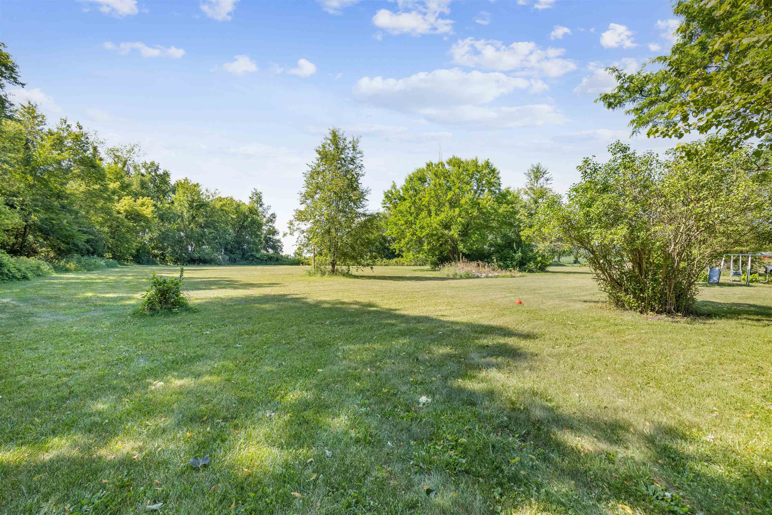 7660 Stephens Road Rockton, IL 61072 - Photo 29 of 34 a view of outdoor space with deck and yard