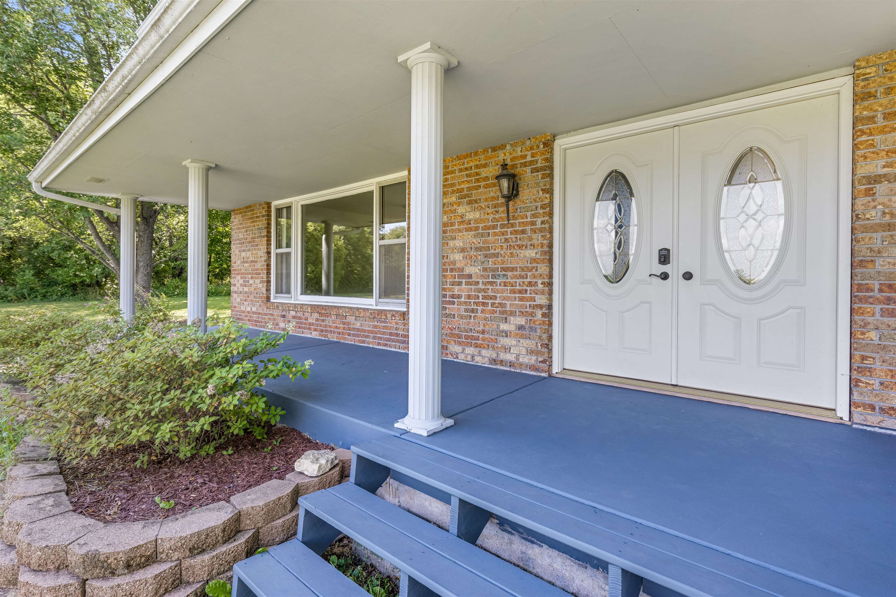 7660 Stephens Road Rockton, IL 61072 - Photo 3 of 34 a front view of a house with garden