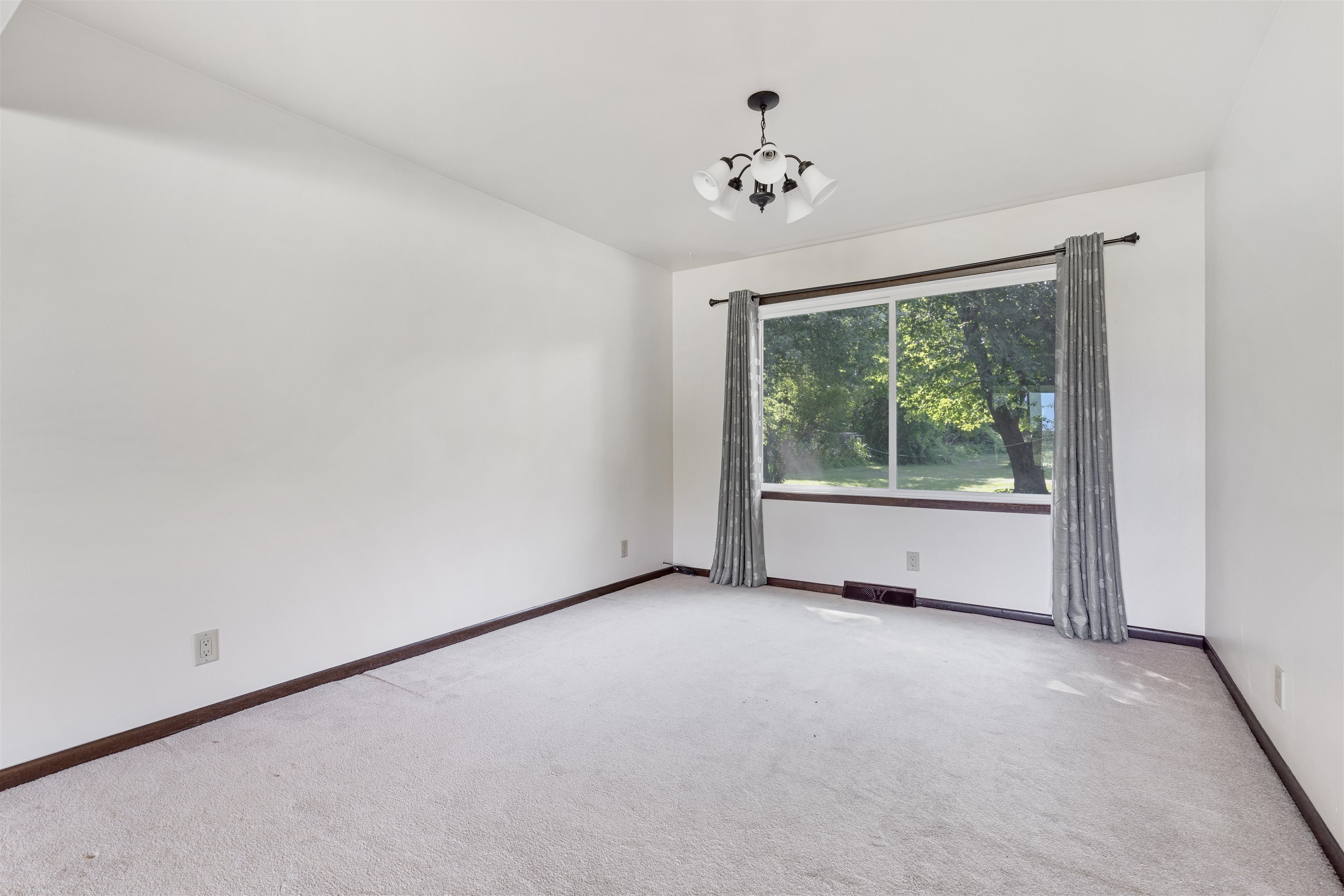 7660 Stephens Road Rockton, IL 61072 - Photo 6 of 34 a view of an empty room with a window