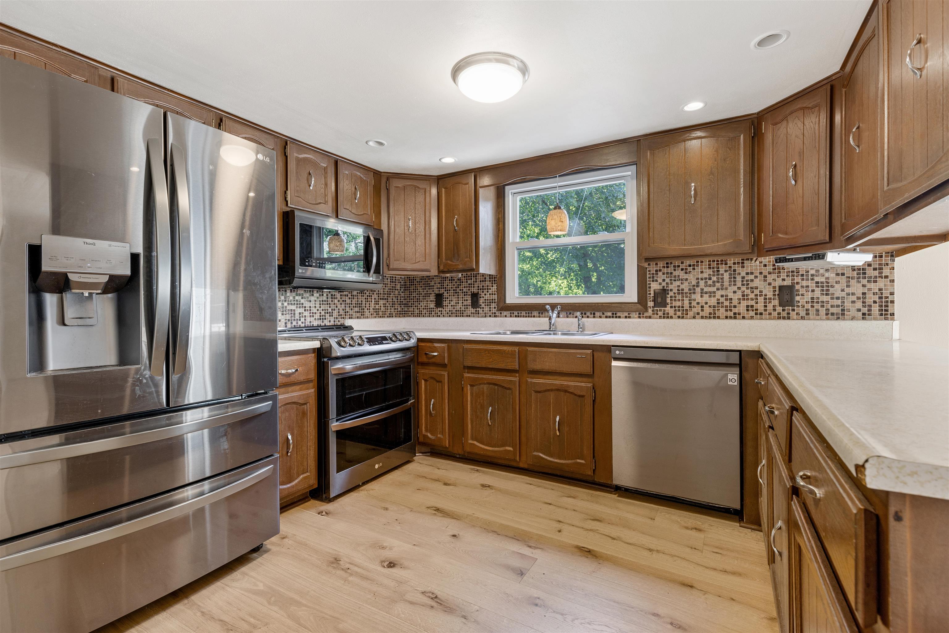 7660 Stephens Road Rockton, IL 61072 - Photo 7 of 34 a kitchen with stainless steel appliances kitchen island granite countertop a refrigerator stove and sink