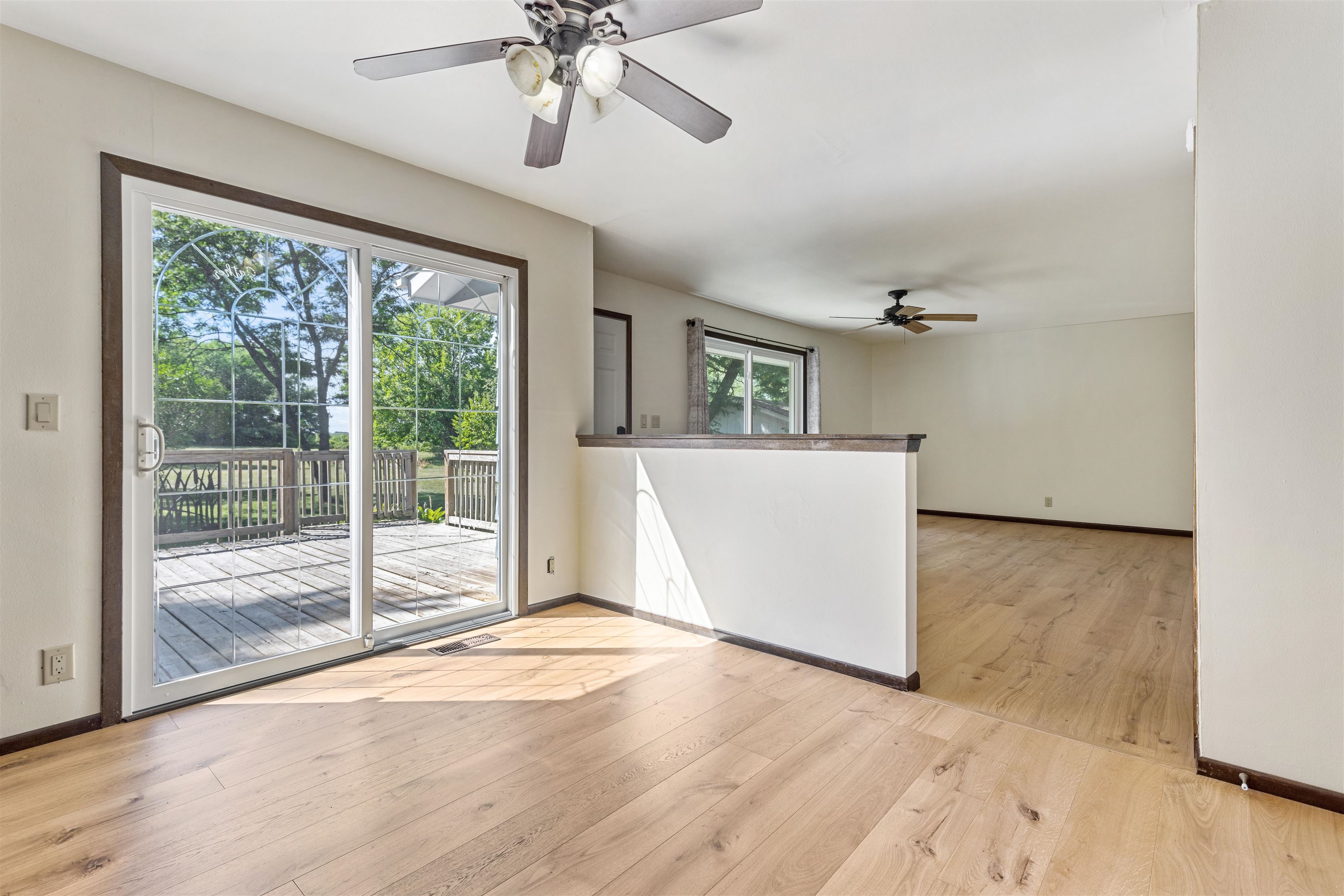 7660 Stephens Road Rockton, IL 61072 - Photo 10 of 34 a view of empty room with wooden floor and fan