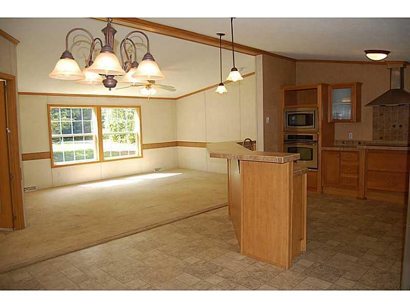 75 Sands Crossing Road Waterboro, ME 04087 - Photo 8 of 13 Living Room. View into Living room area
