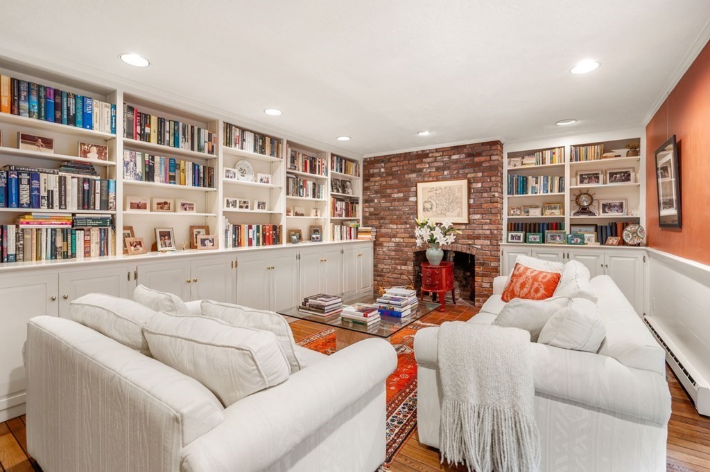 17 Fields Pond Road Weston, MA 02493 - Photo 12 of 41 a living room with furniture and a book shelf