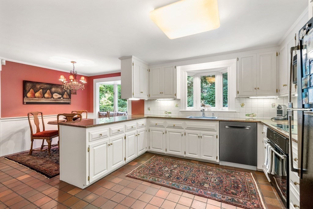 17 Fields Pond Road Weston, MA 02493 - Photo 15 of 41 a kitchen with stainless steel appliances granite countertop a stove a sink and a refrigerator