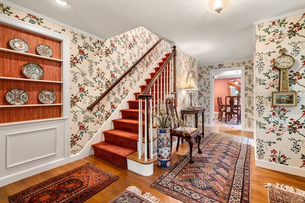 17 Fields Pond Road Weston, MA 02493 - Photo 20 of 41 a view of entryway livingroom and hall with wooden floor