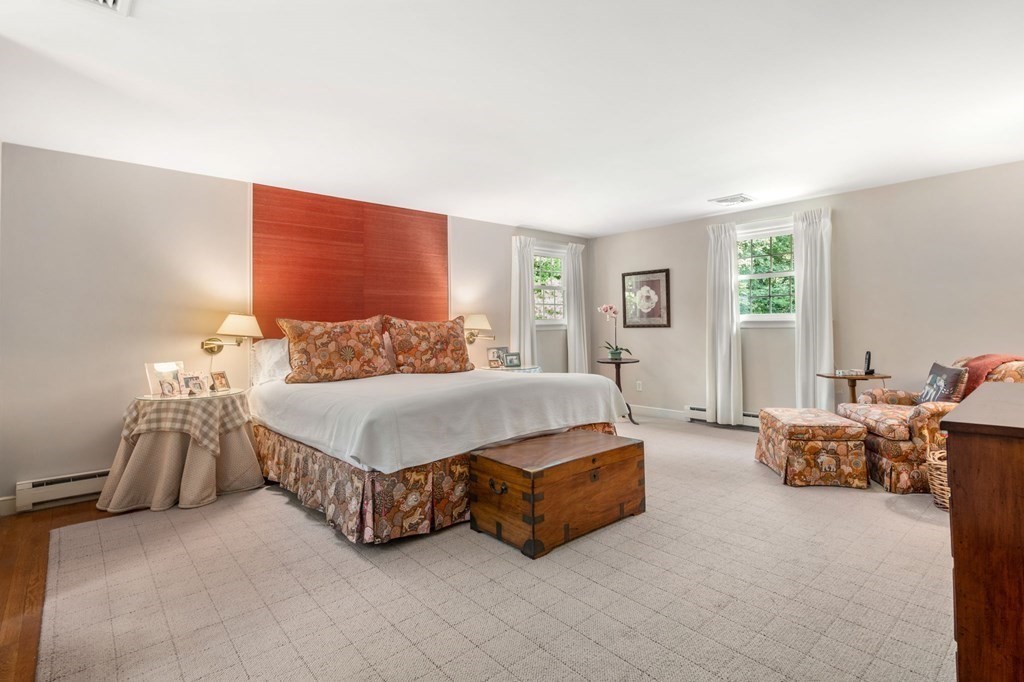 17 Fields Pond Road Weston, MA 02493 - Photo 21 of 41 a spacious bedroom with a bed and a couch