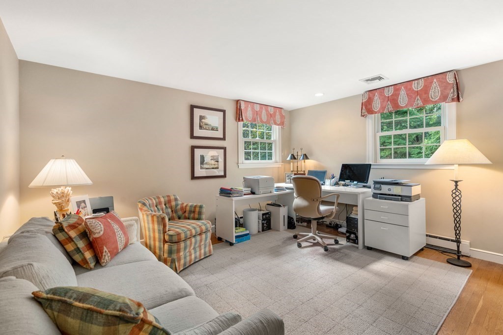 17 Fields Pond Road Weston, MA 02493 - Photo 23 of 41 a living room with furniture and a window