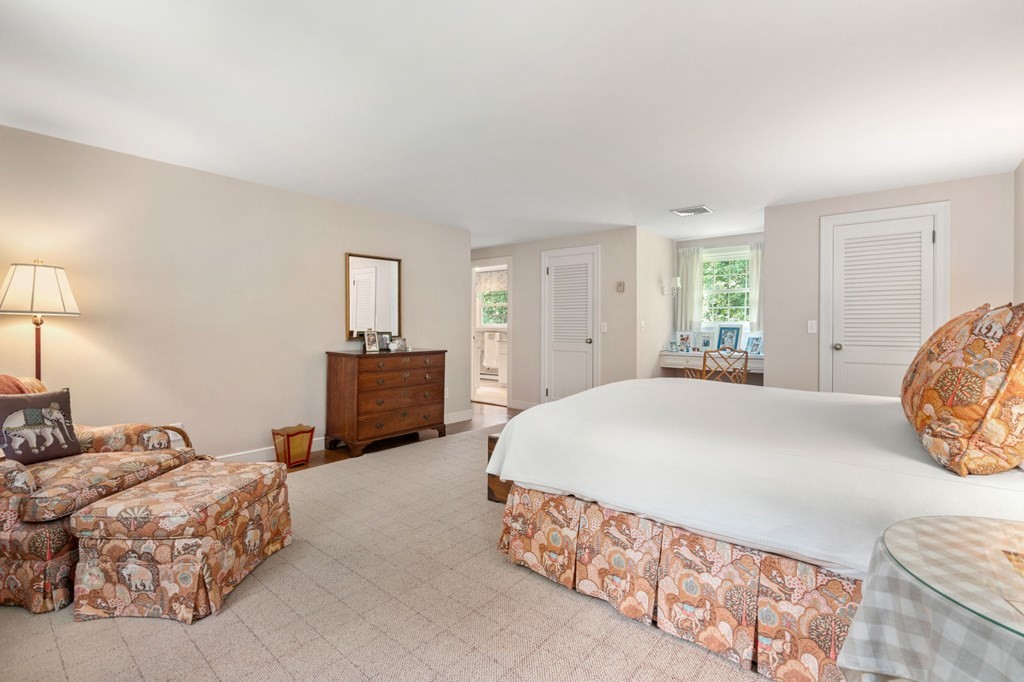 17 Fields Pond Road Weston, MA 02493 - Photo 26 of 41 a bedroom with a bed and a dresser