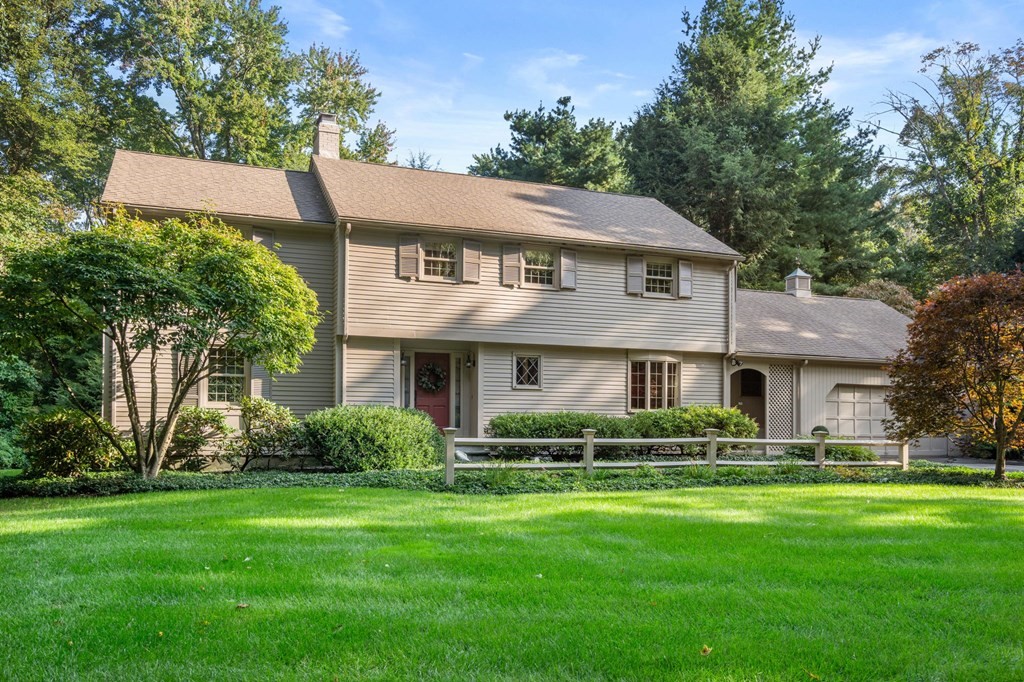 17 Fields Pond Road Weston, MA 02493 - Photo 3 of 41 a front view of a house with a yard and trees