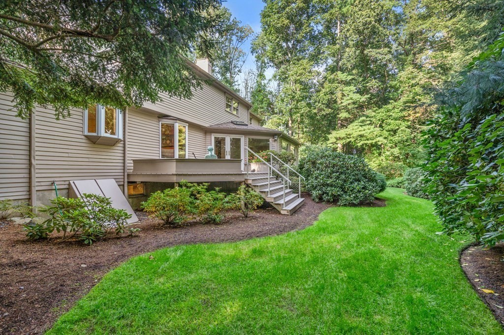17 Fields Pond Road Weston, MA 02493 - Photo 32 of 41 a front view of a house with a yard