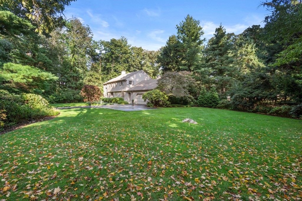17 Fields Pond Road Weston, MA 02493 - Photo 40 of 41 a view of a house with a yard porch and sitting area