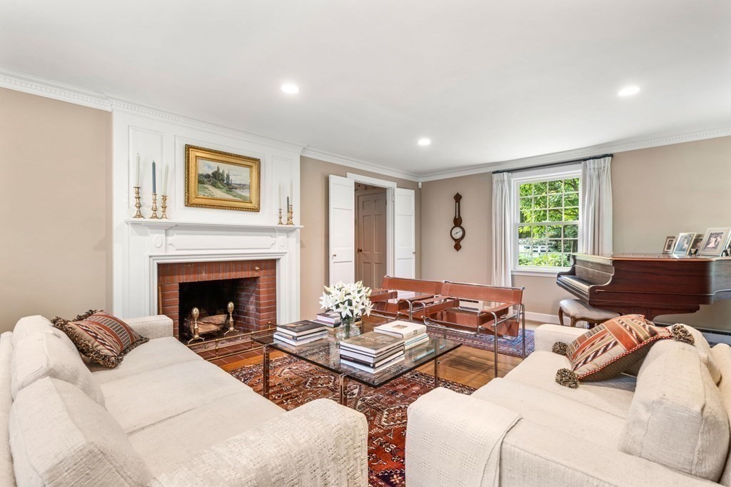 17 Fields Pond Road Weston, MA 02493 - Photo 6 of 41 a living room with furniture and a fireplace