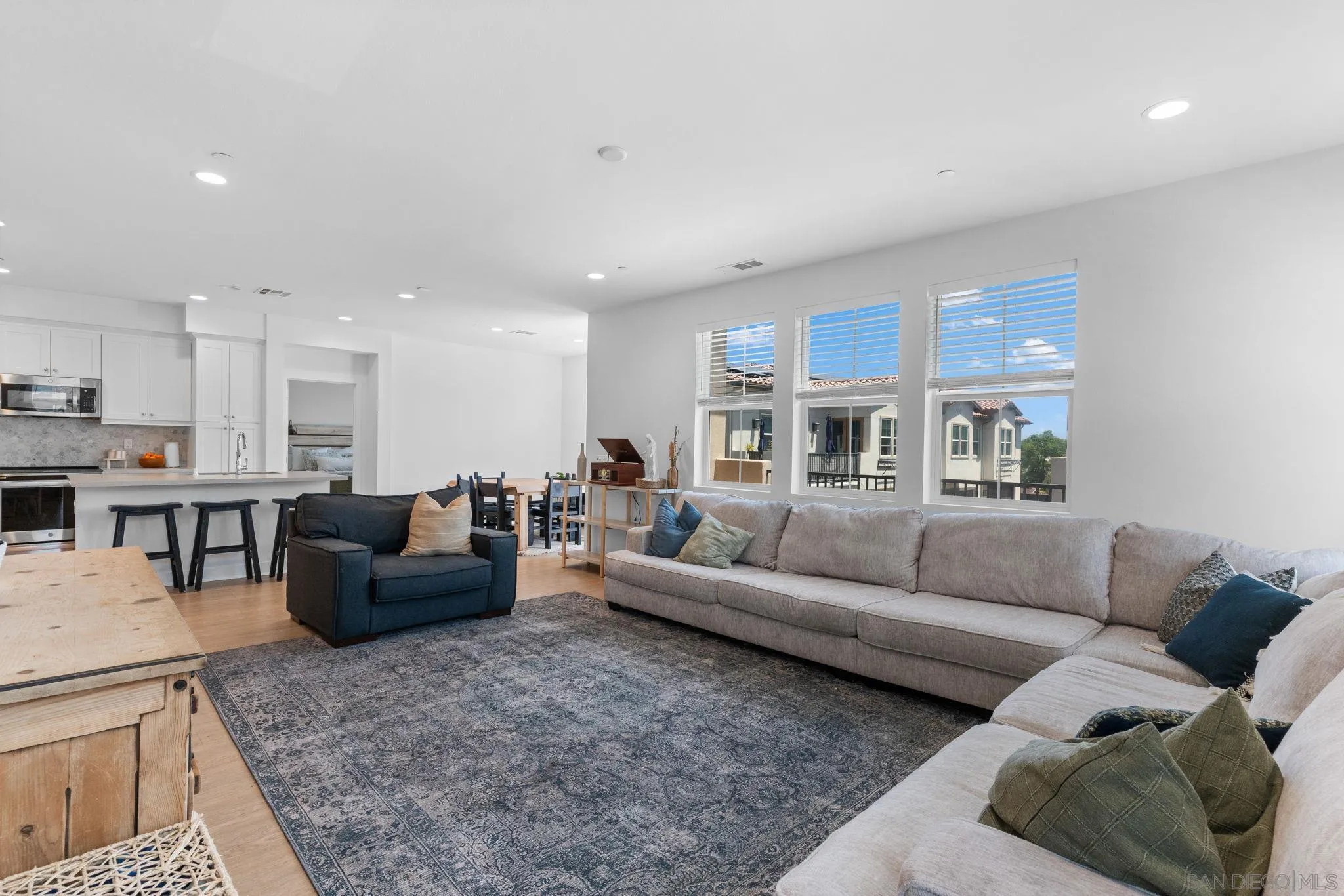 8702 Barbados Lane Santee, CA 92071 - Photo 12 of 39 a living room with furniture and a view of kitchen