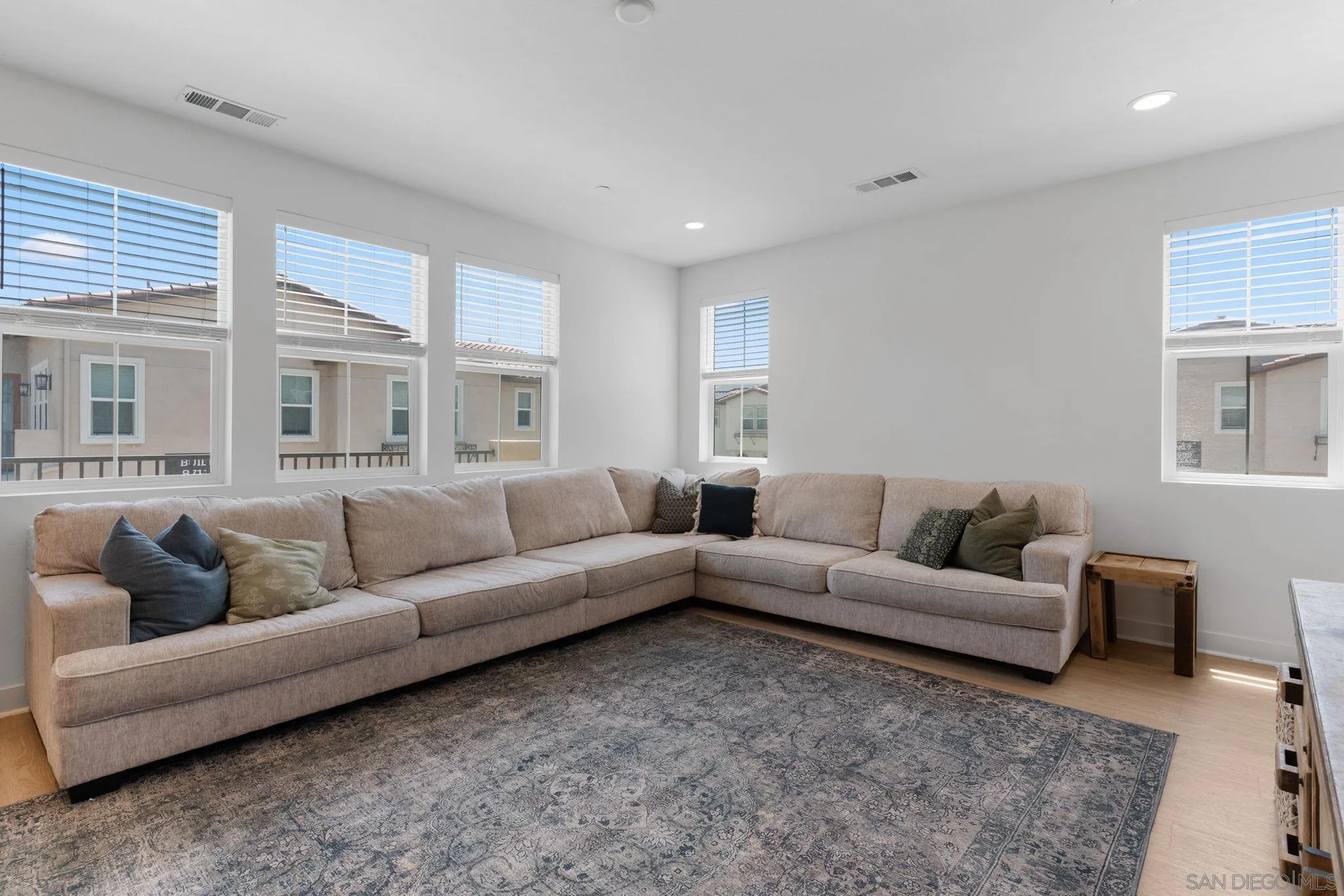 8702 Barbados Lane Santee, CA 92071 - Photo 14 of 39 a living room with furniture and a large window