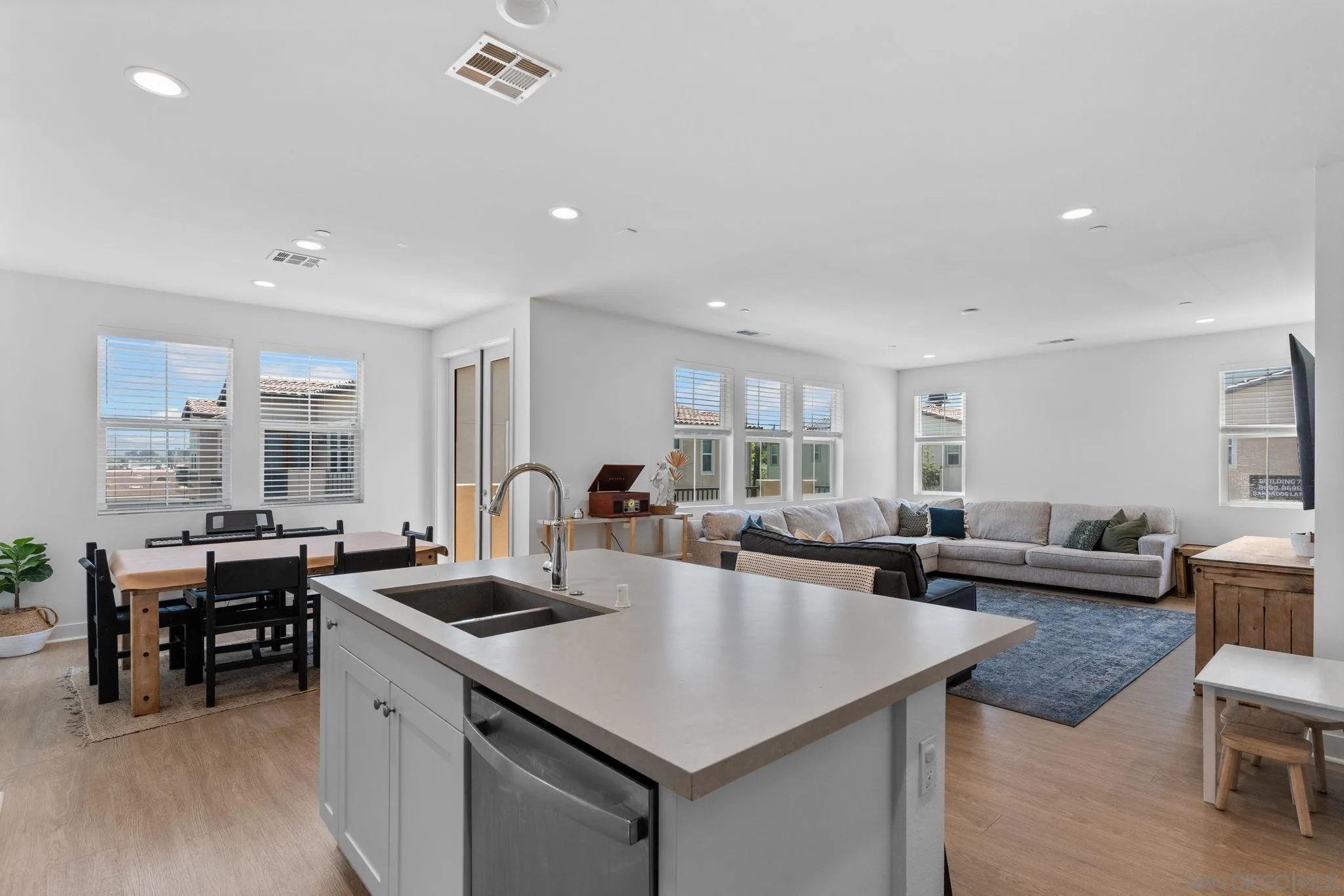 8702 Barbados Lane Santee, CA 92071 - Photo 18 of 39 a kitchen with counter space dining table and chairs