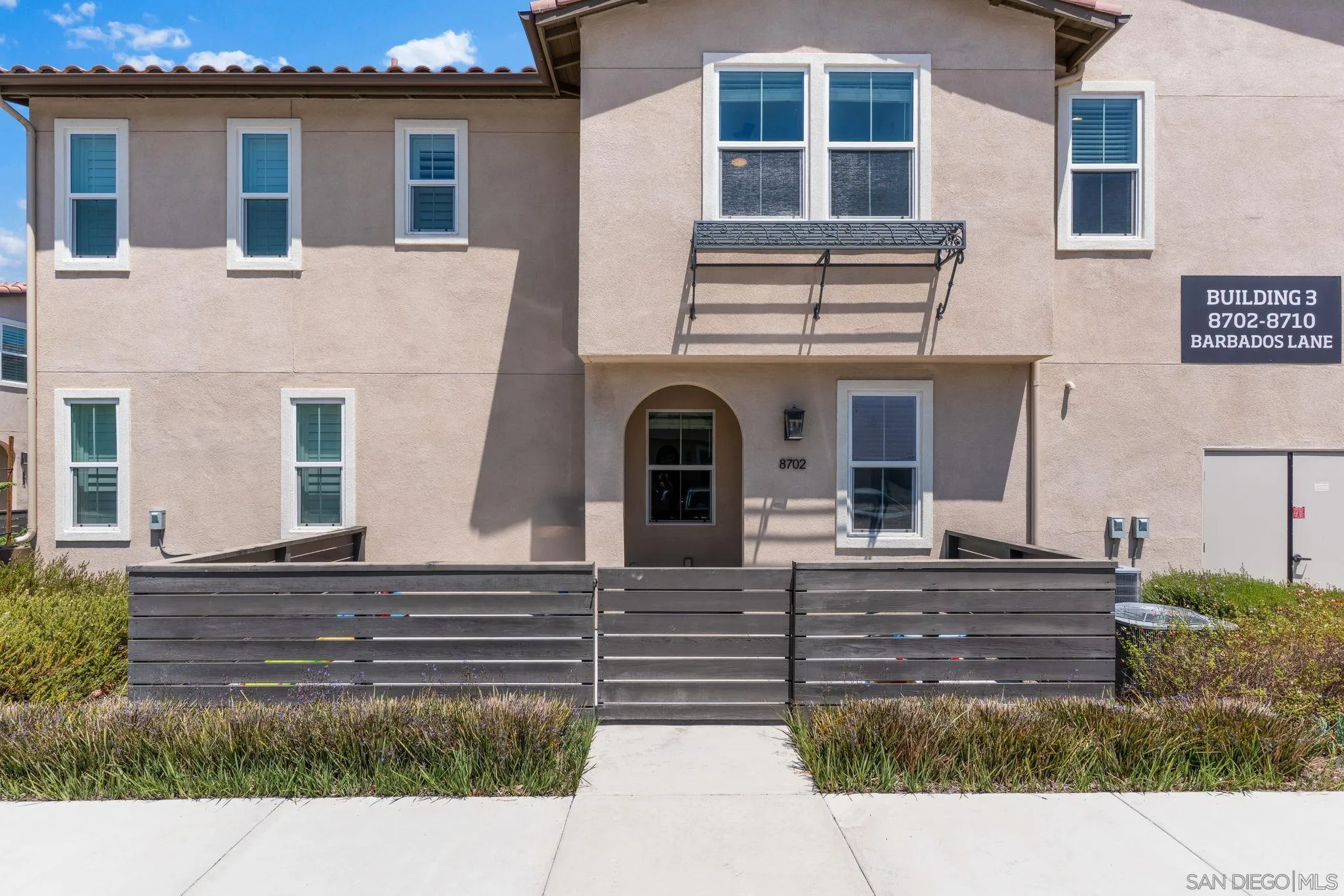 8702 Barbados Lane Santee, CA 92071 - Photo 2 of 39 a front view of a house with garage