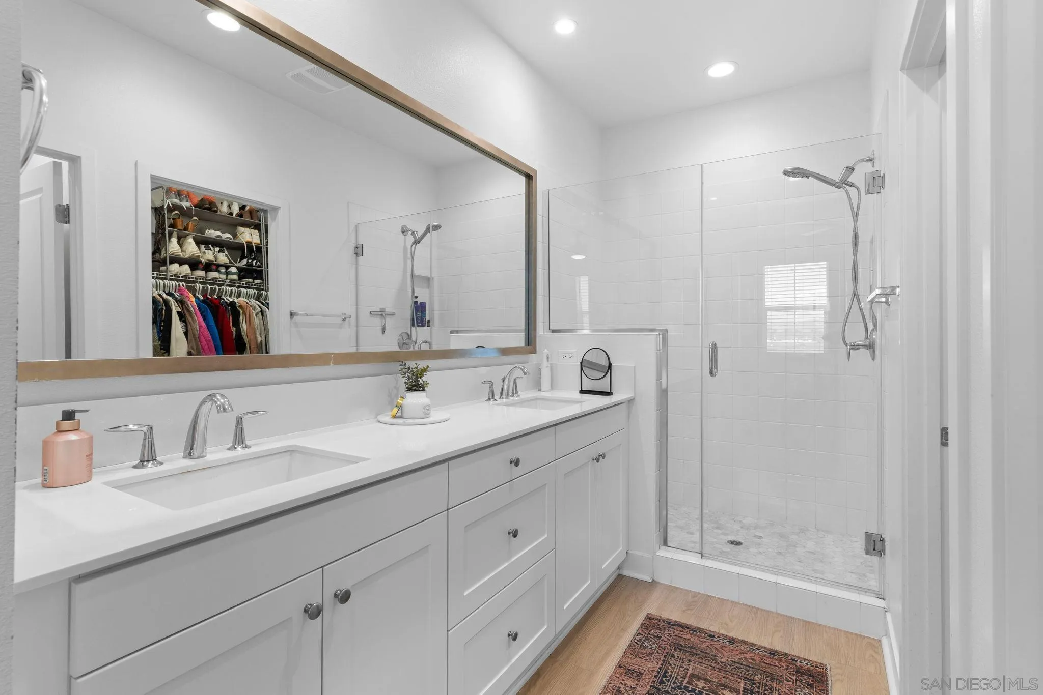 8702 Barbados Lane Santee, CA 92071 - Photo 22 of 39 a bathroom with double sink and a mirror