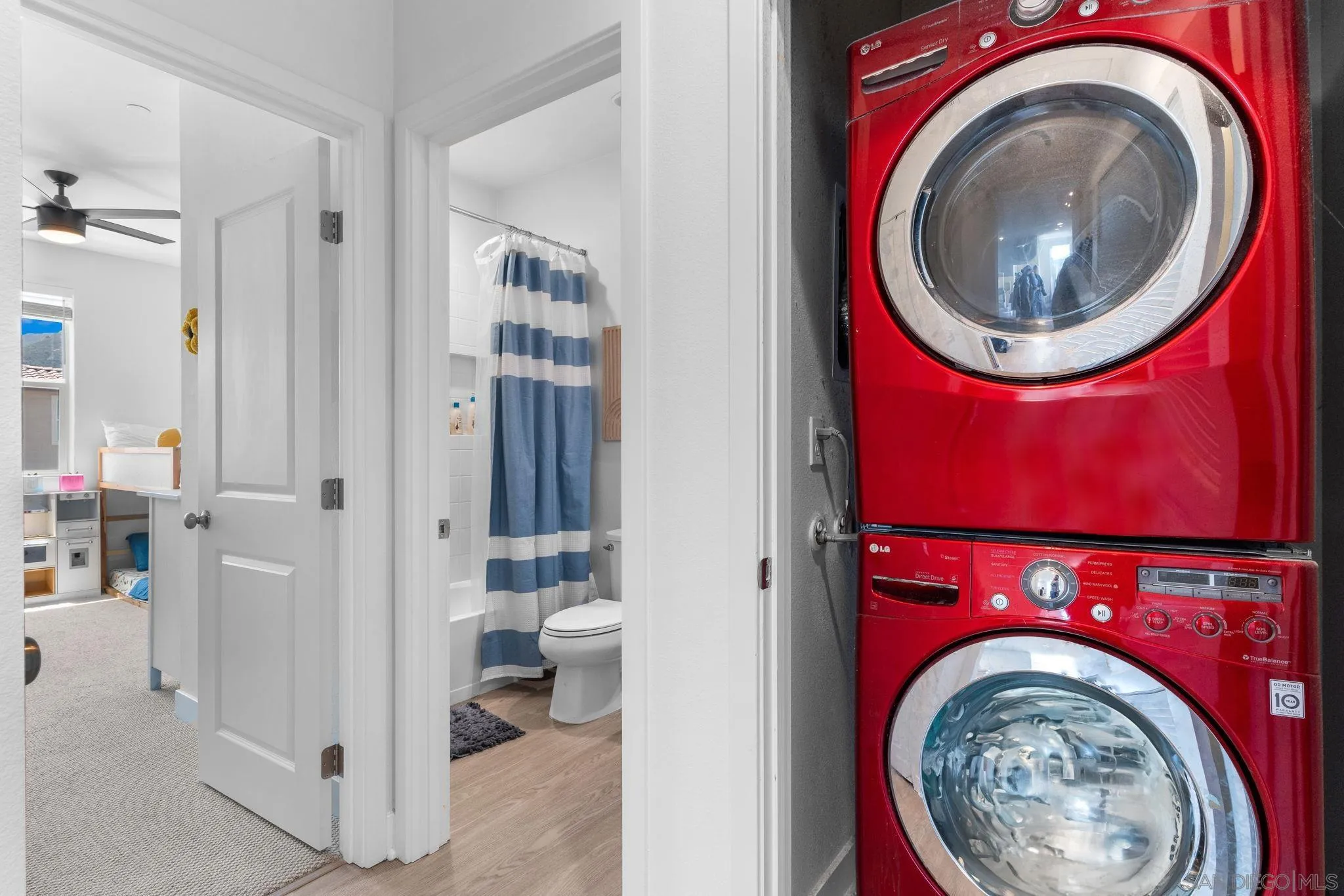 8702 Barbados Lane Santee, CA 92071 - Photo 25 of 39 a view of a bedroom with washer and dryer