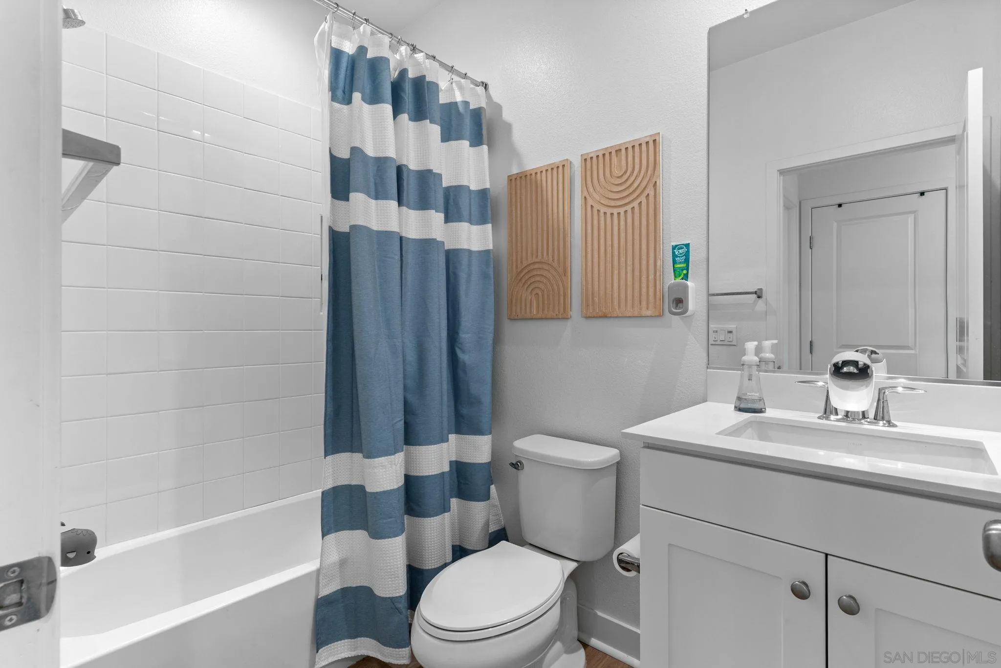 8702 Barbados Lane Santee, CA 92071 - Photo 26 of 39 a bathroom with a sink toilet and shower
