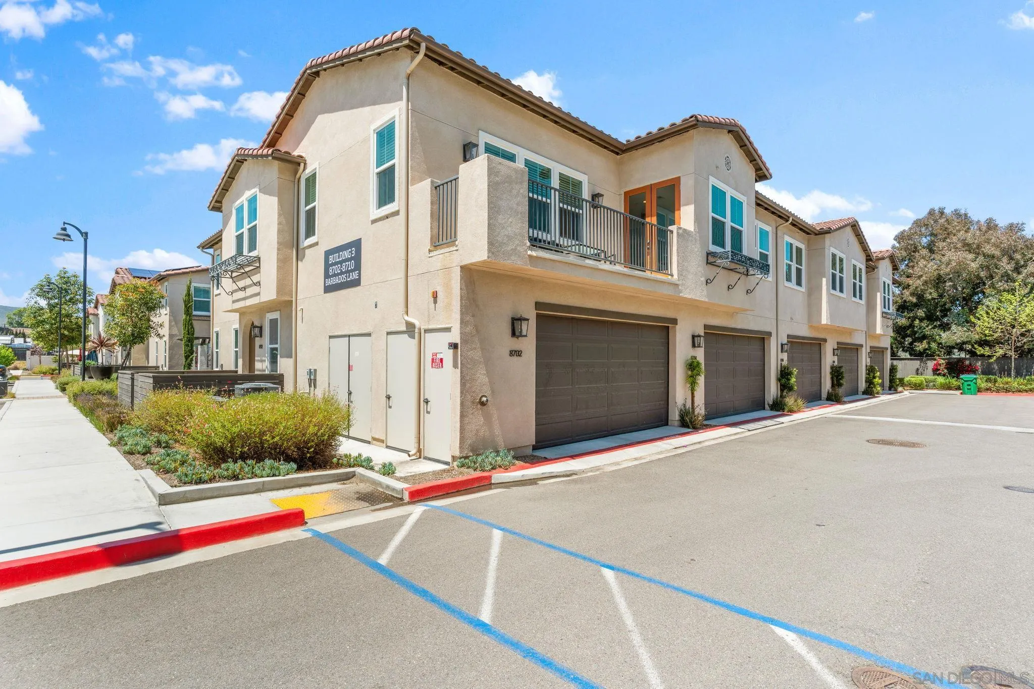 8702 Barbados Lane Santee, CA 92071 - Photo 32 of 39 a front view of a building with garage