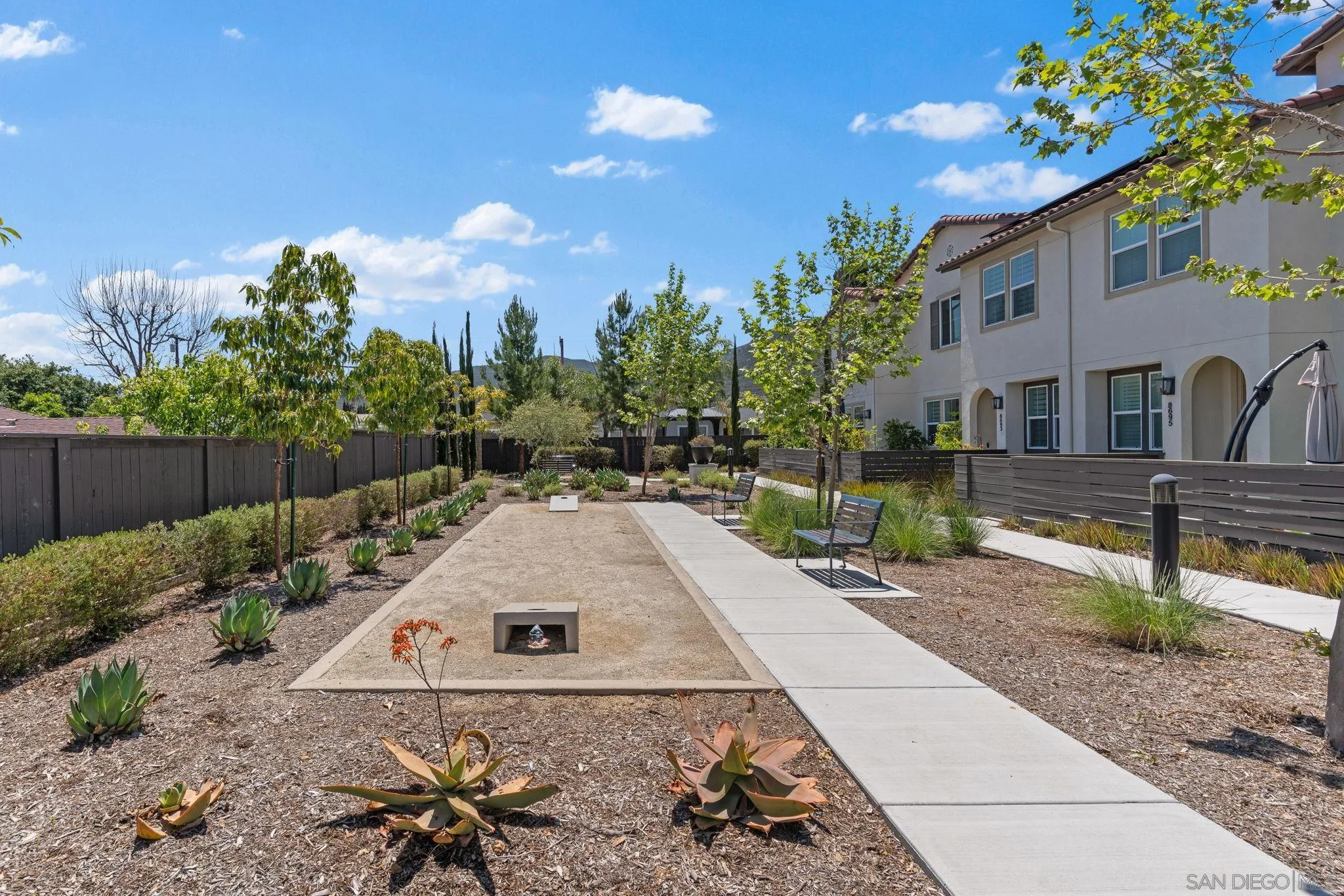 8702 Barbados Lane Santee, CA 92071 - Photo 34 of 39 a view of a house with a yard and sitting area