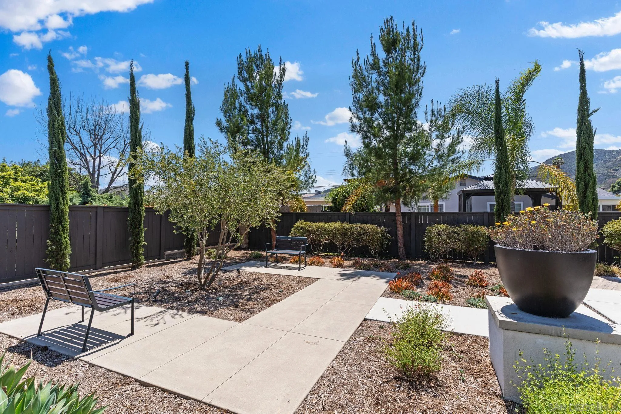 8702 Barbados Lane Santee, CA 92071 - Photo 36 of 39 a view of a backyard with sitting area