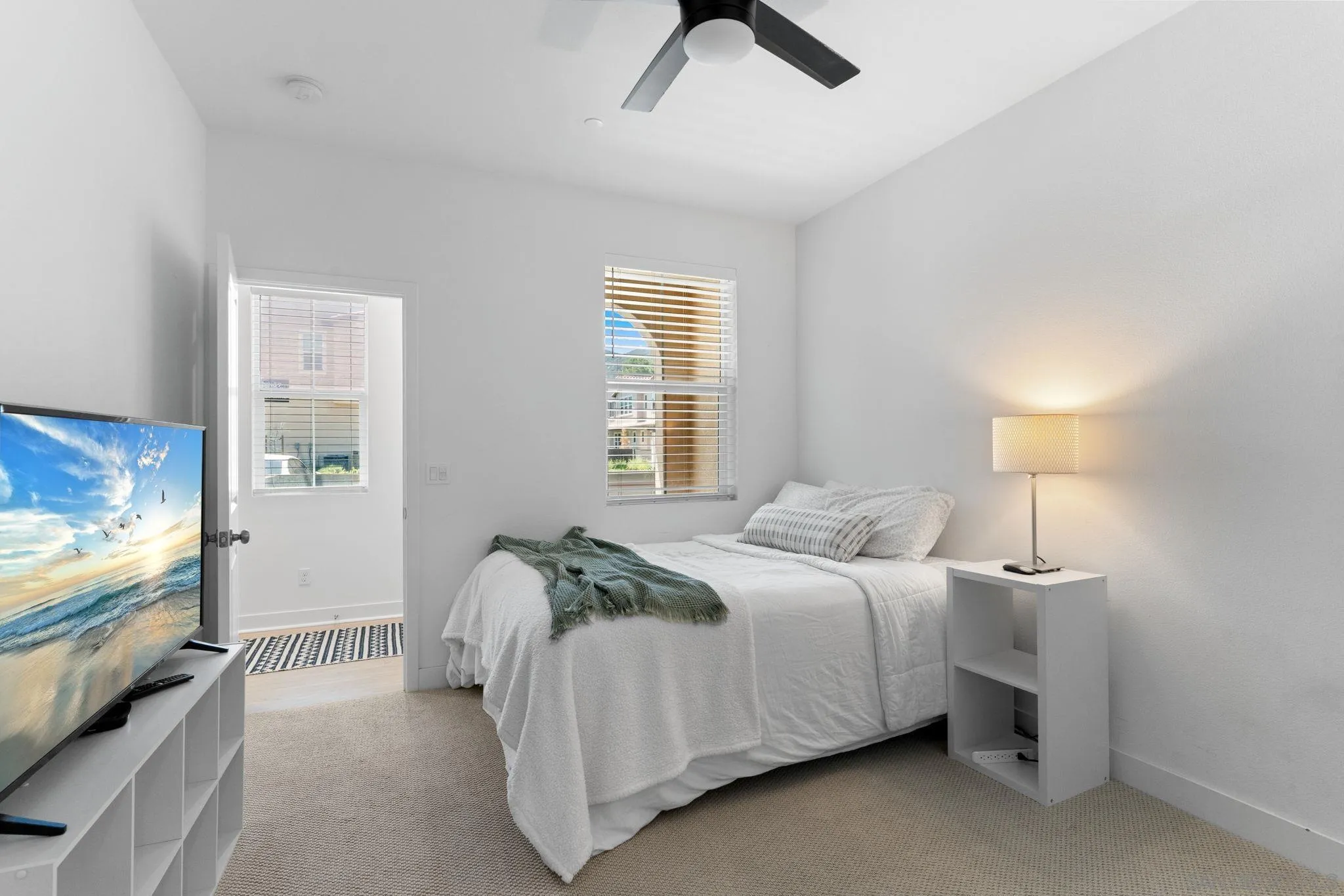 8702 Barbados Lane Santee, CA 92071 - Photo 8 of 39 a bedroom with a bed and a flat screen tv