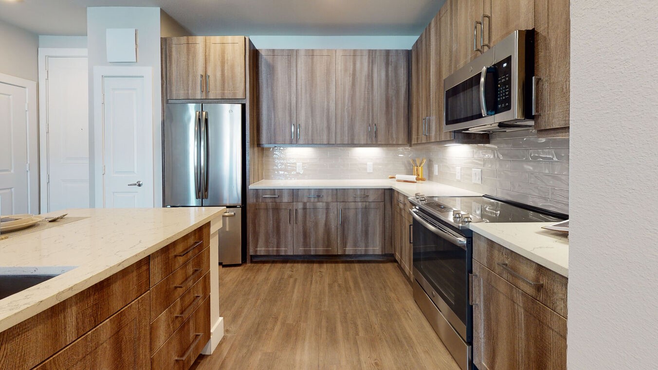 24002 Colonial Parkway, Unit 6307 Katy, TX 77493 - Photo 9 of 31 a kitchen with a sink stove and refrigerator