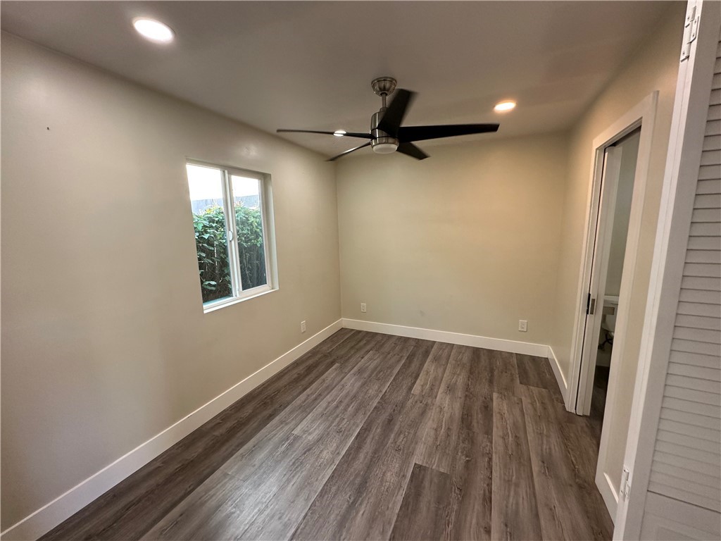 2155 Summit Avenue Altadena, CA 91001 - Photo 5 of 7 an empty room with wooden floor and windows