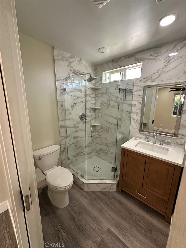 2155 Summit Avenue Altadena, CA 91001 - Photo 7 of 7 a bathroom with a sink toilet a mirror and shower