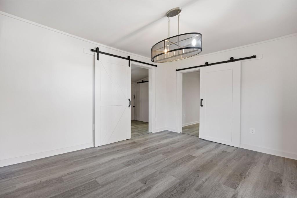 24 East Iron Belt Road Southeast Cartersville, GA 30120 - Photo 14 of 35 a view of empty room with wooden floor