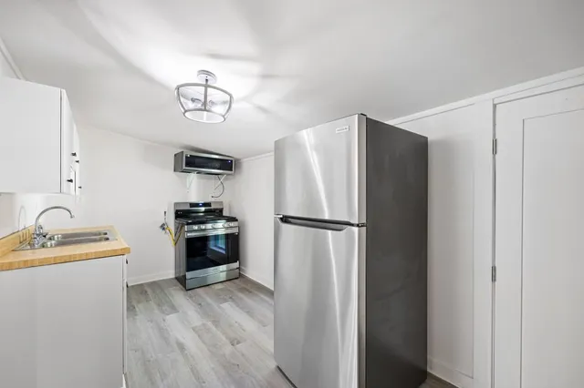 a kitchen with a stove and a sink
