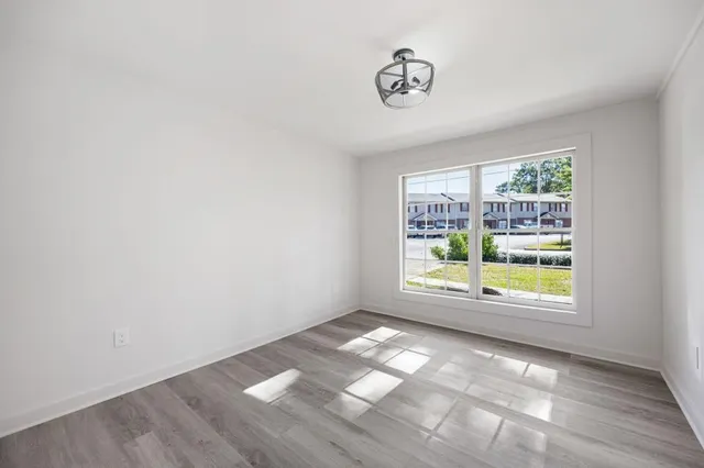 an empty room with wooden floor