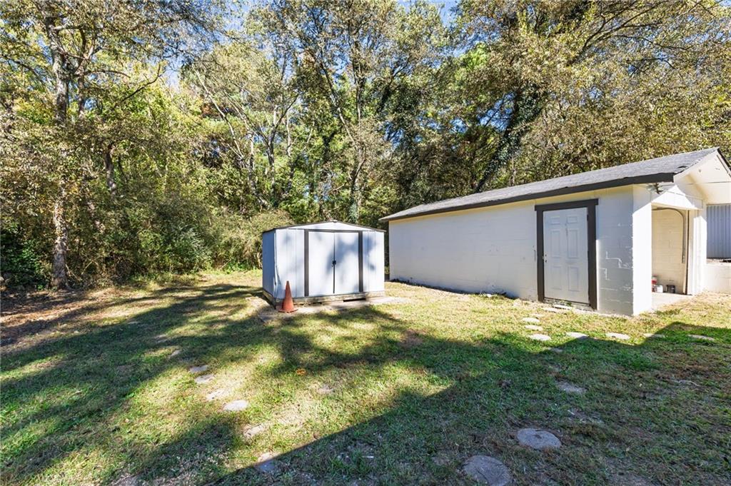 24 East Iron Belt Road Southeast Cartersville, GA 30120 - Photo 29 of 35 a backyard of a house with yard and outdoor seating