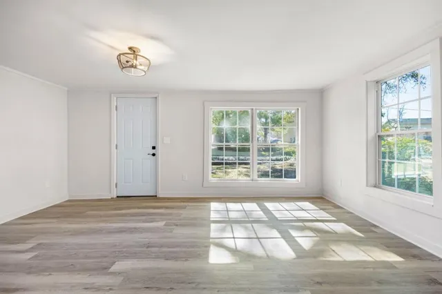 a view of an empty room with a window
