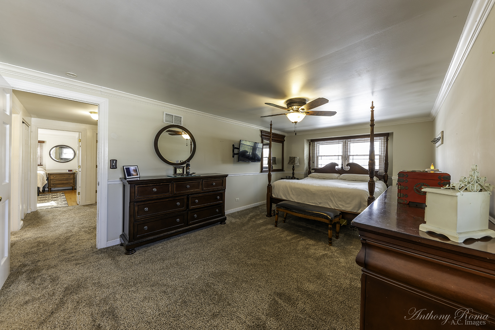 533 Beck Road Lindenhurst, IL 60046 - Photo 12 of 19 a spacious bedroom with a bed and a chandelier