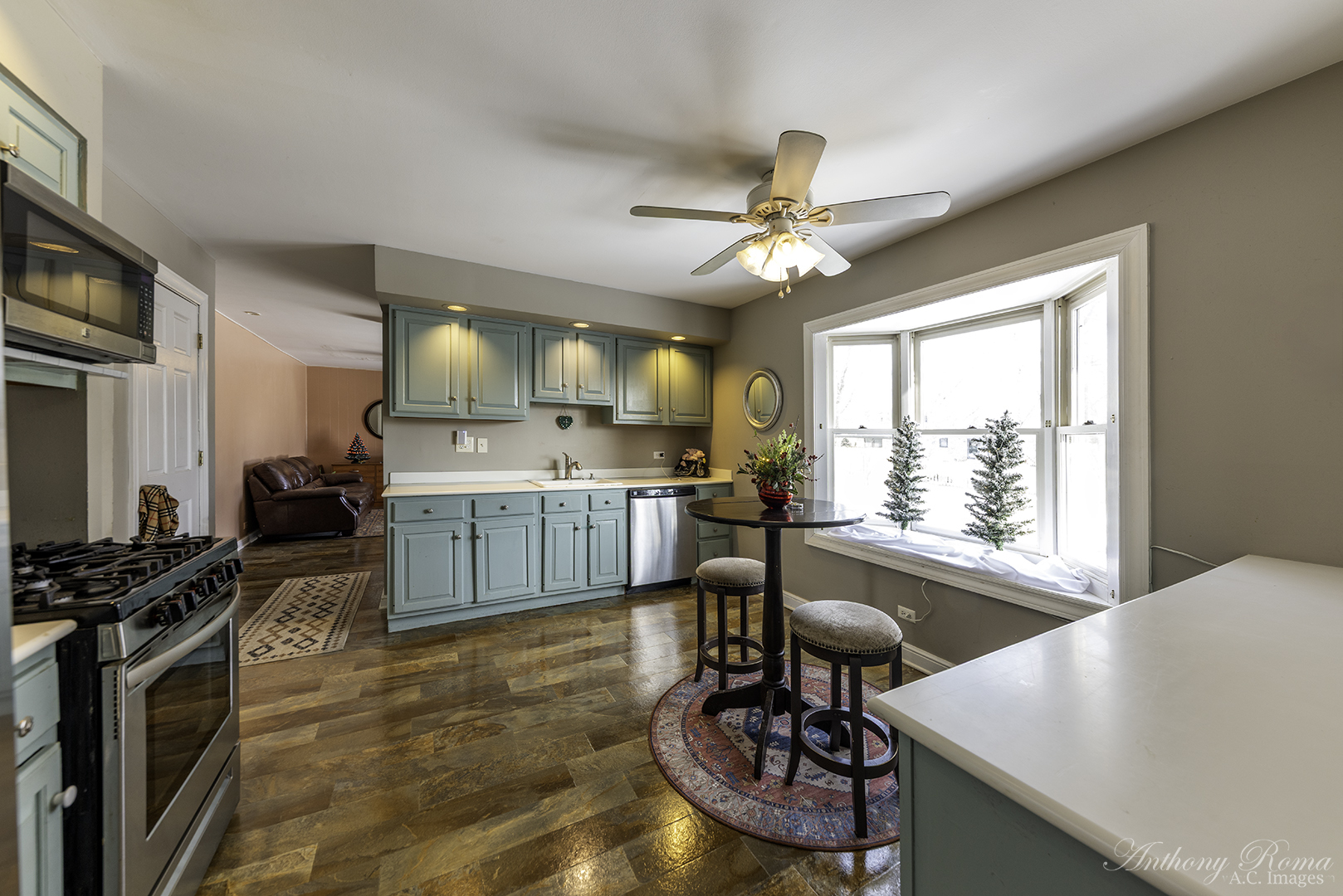 533 Beck Road Lindenhurst, IL 60046 - Photo 7 of 19 a living room with furniture a flat screen tv and a window