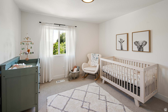 461 West 490 North Lindon, UT 84042 - Photo 14 of 18 Bedroom with a crib and light carpet