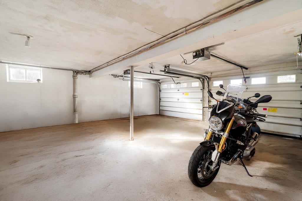 97 MacArthur Road Stoneham, MA 02180 - Photo 27 of 30 a view of a garage with furniture