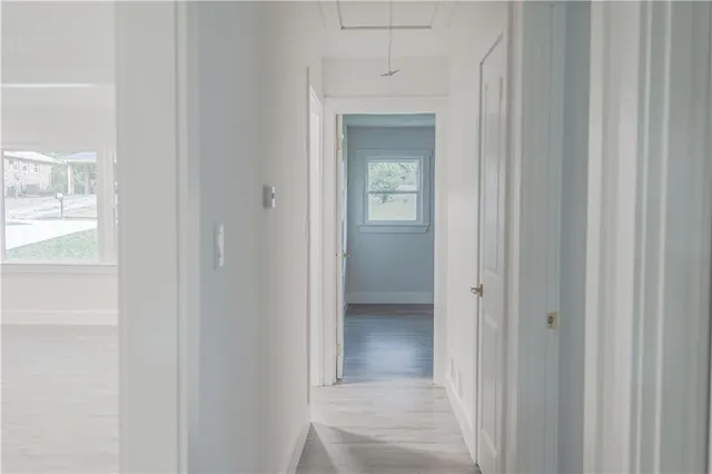 a view of backyard with deck and wooden floor