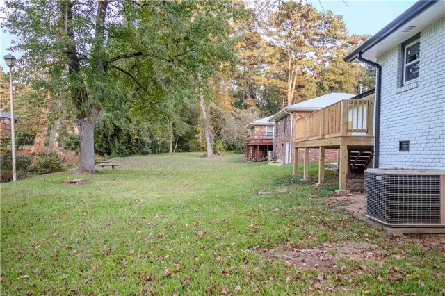 a bathroom with a shower and a door