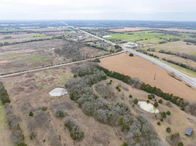 a view of a lake with beach and city view