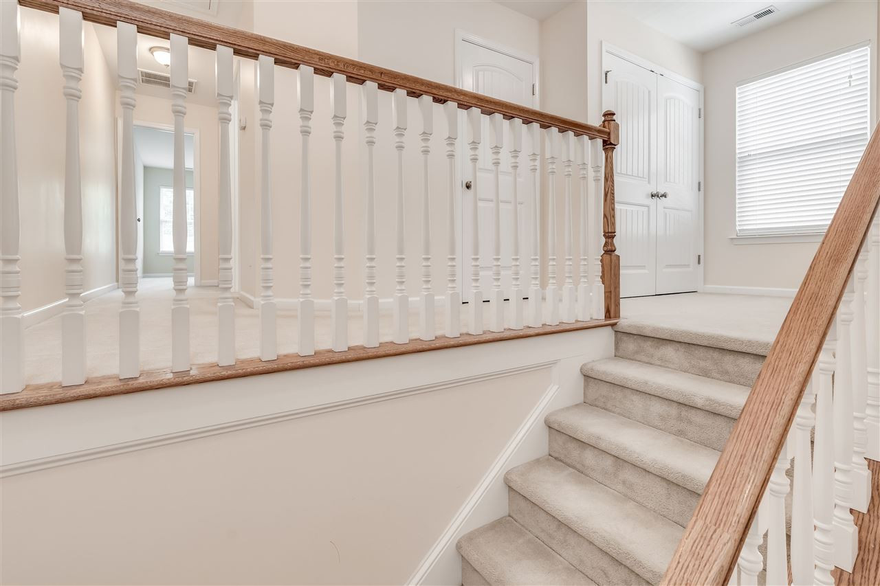 2443 Memory Ridge Drive Raleigh, NC 27606 - Photo 12 of 28 Wide landing; laundry area and hallway to other bedrooms Landing