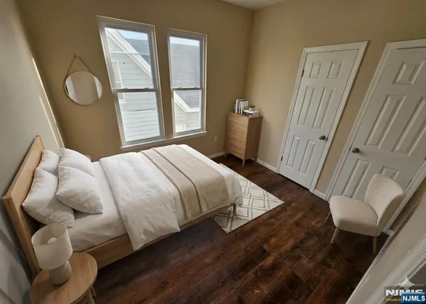 a bedroom with a bed and window