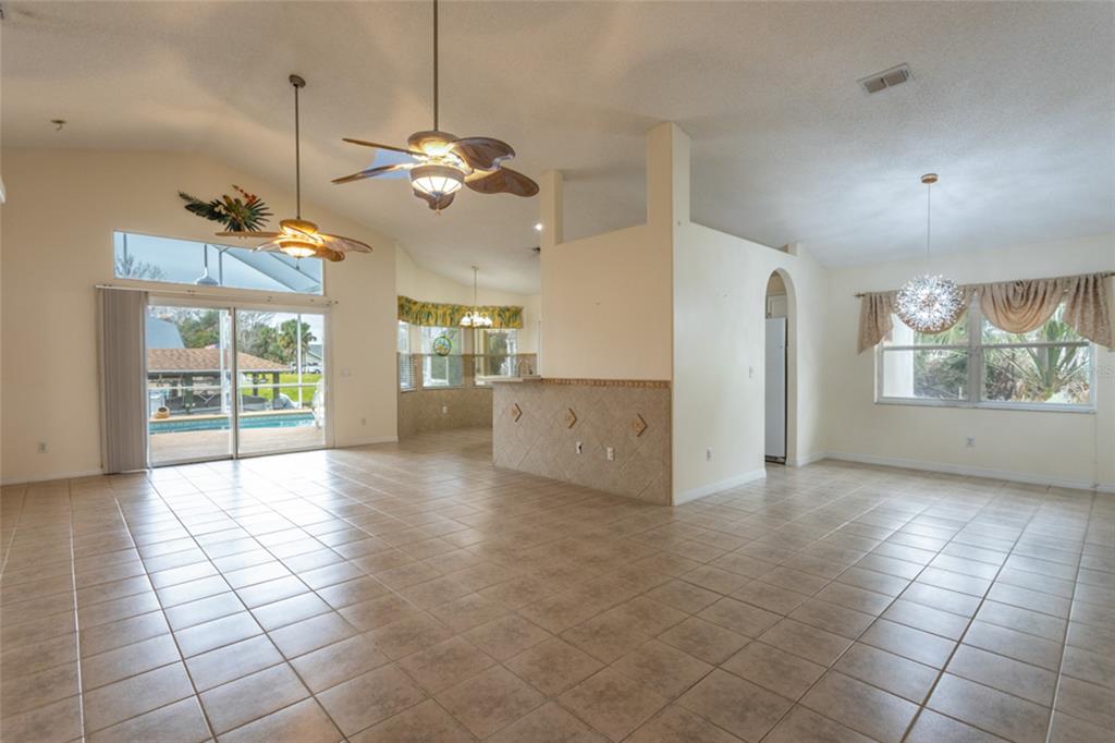 21 Comanche Court Palm Coast, FL 32137 - Photo 16 of 50 a view interior of a house wooden floor a ceiling fan and windows