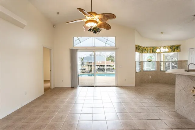 a living room with furniture a chandelier and a couch