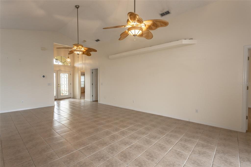 21 Comanche Court Palm Coast, FL 32137 - Photo 20 of 50 a view of an empty room with a chandelier fan