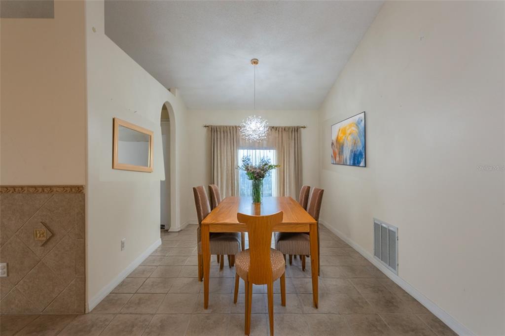 21 Comanche Court Palm Coast, FL 32137 - Photo 23 of 50 a dining room with furniture and window