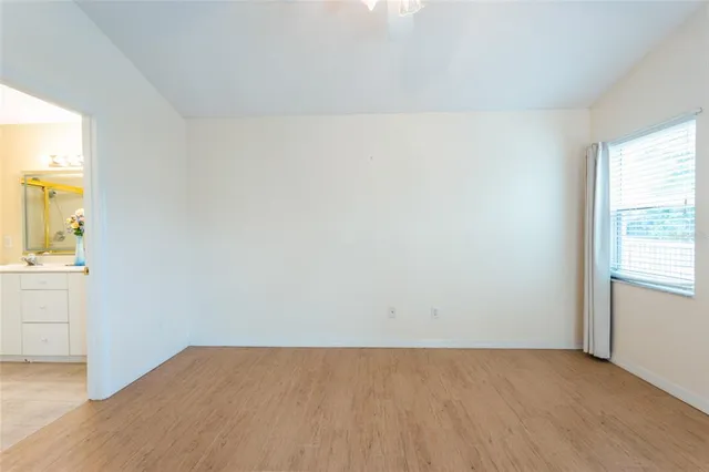 a view of an empty room with a window