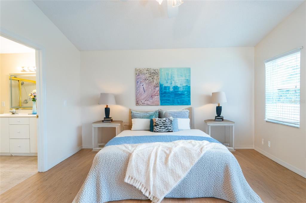 21 Comanche Court Palm Coast, FL 32137 - Photo 26 of 50 a bedroom with a bed and a window